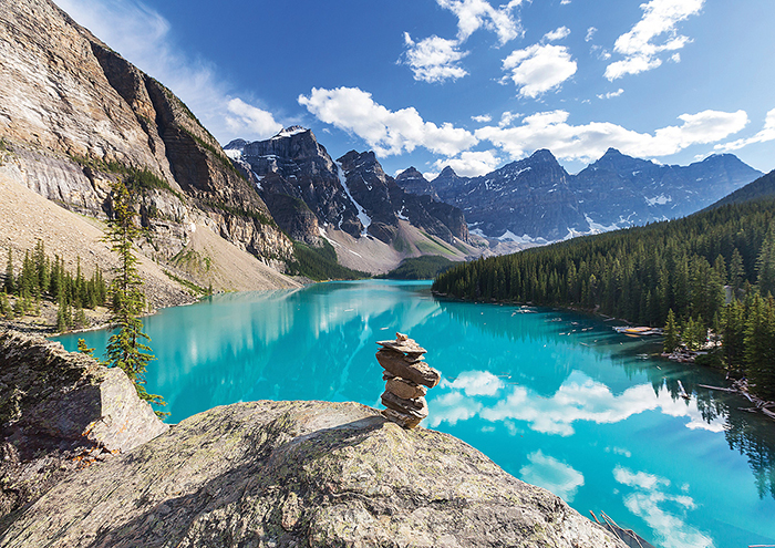 A lake surrounded with mountains and forest