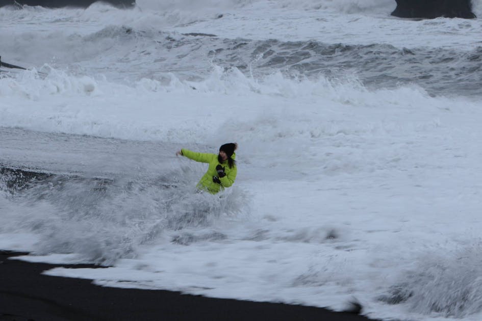 Woman in the strong waves