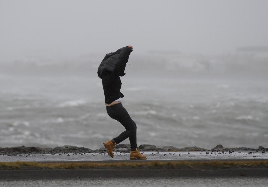 A person fighting with the strong wind