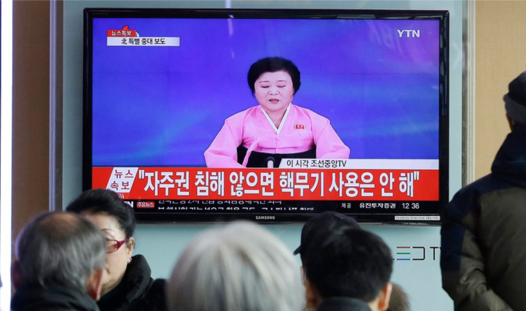 North Koreans watching tv