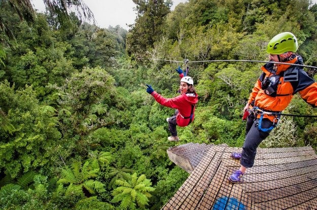 Couple trying ziplining in the jungle of Costa Rica