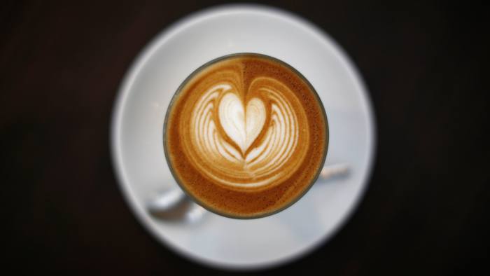 cup of coffee with cream from above