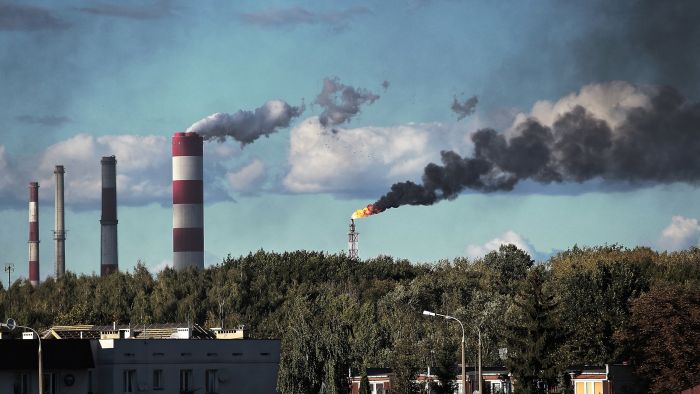 refinery chimneys smoking