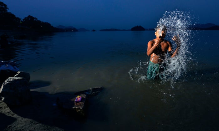 a man night swimming in a river