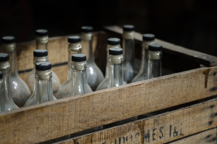 Glass bottles in a wooden box