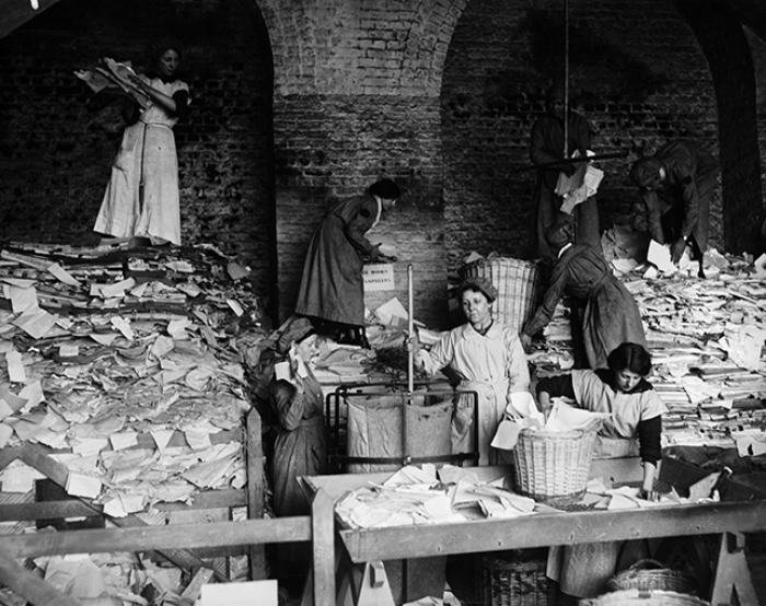 Old photo of women recycling paper