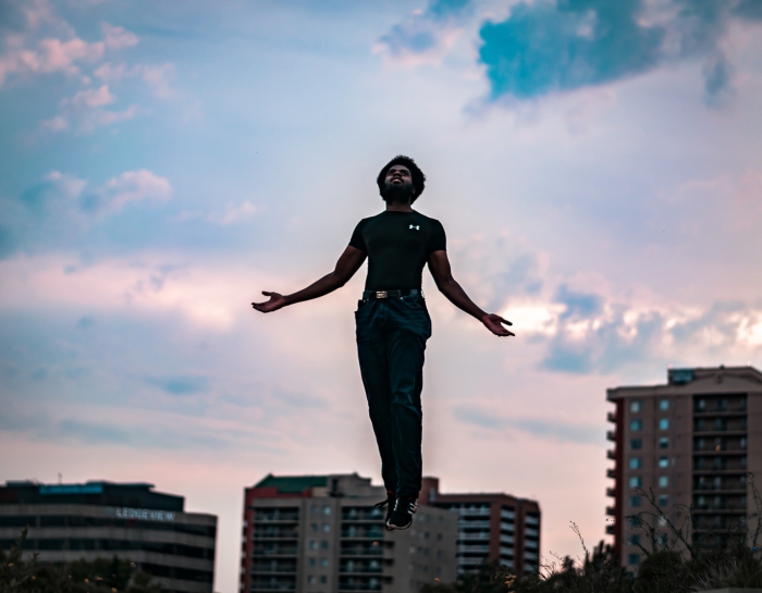 Man with superhuman powers floating in air