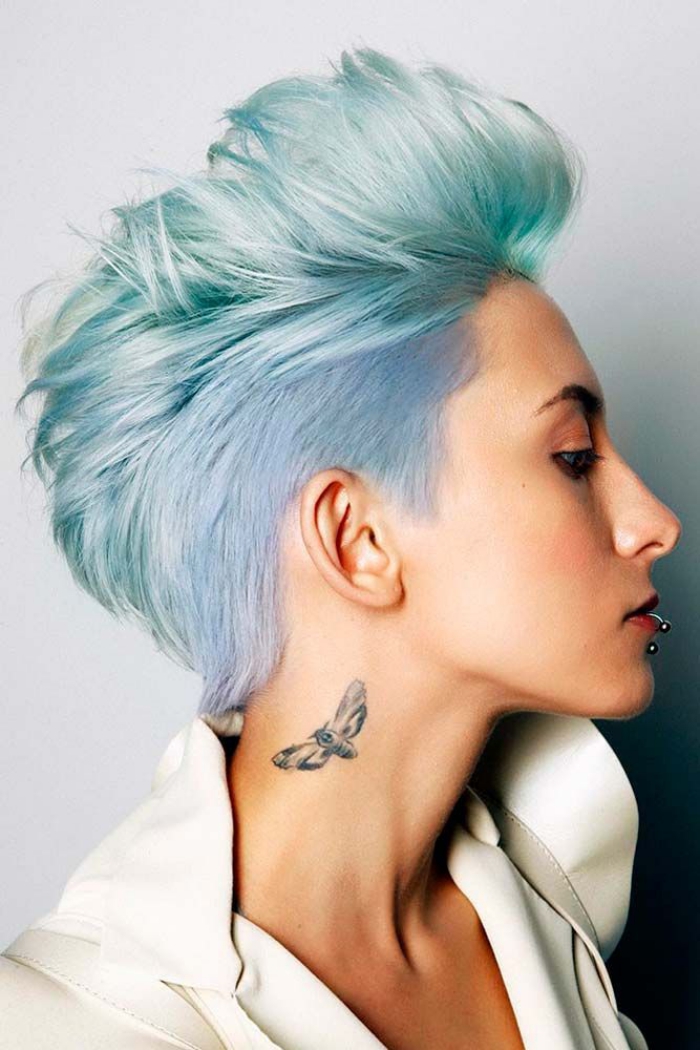 woman profile light blue pixie haircut neck tattoo