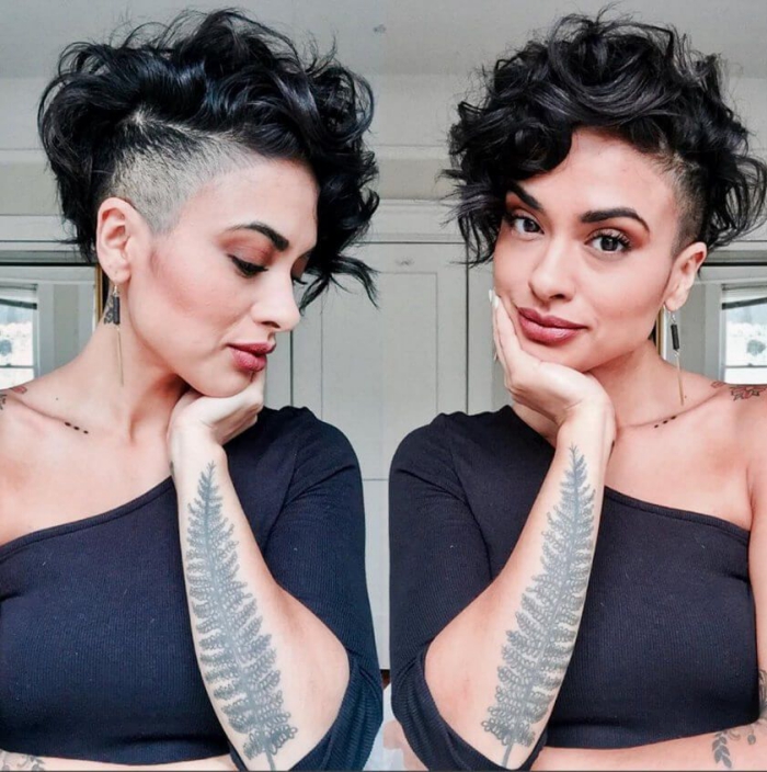 Two shots of a woman with undercut curly pixie dark hair tattoo black top