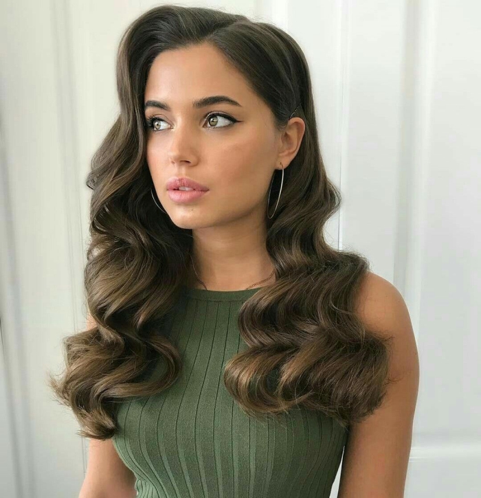 Close up of woman dressed in green with retro waves hairstyle