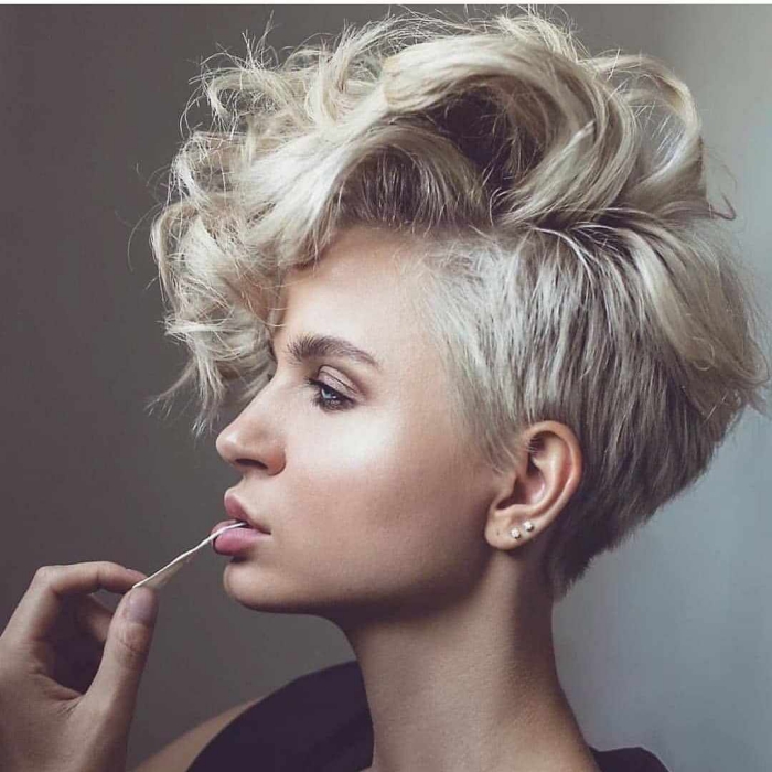 woman profile with blond hair undercut pixie on a light background