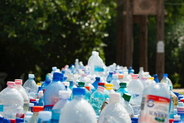 many plastic bottles with colorful caps outdoors