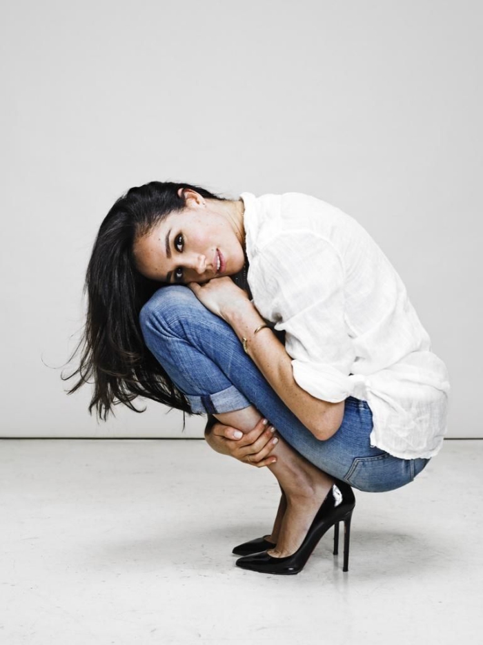 Meghan Markle with jeans and white shirt high heels on white background