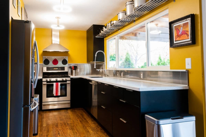 Modern designed kitchen with big windows 