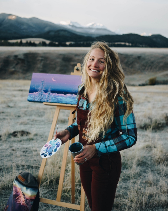 Artist Rachel Pohl painting outdoors smiling 