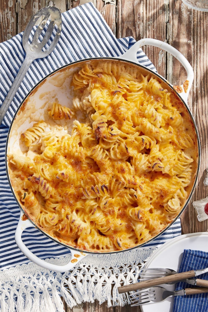 Extra Creamy Mac and Cheese thanksgiving side dish on a table with a spoon