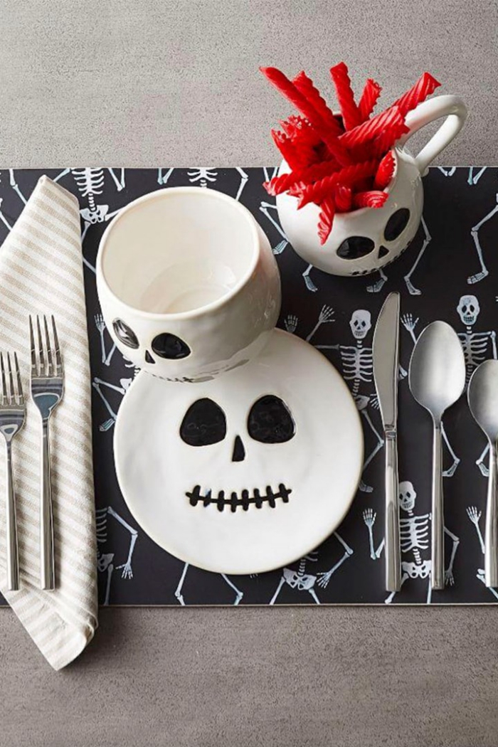 Halloween table decor with skulls and skeletons black and white