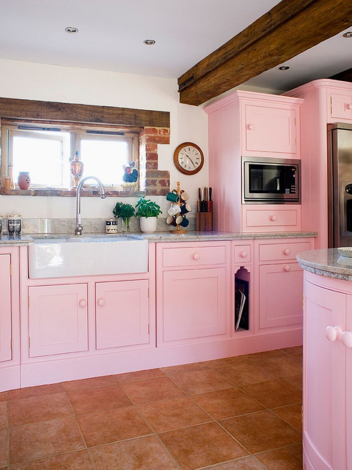 Soft feminine light pink kitchen with wooden elements