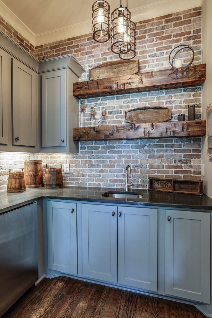 interesting basement kitchen with light grey cabinets and wooden shelves