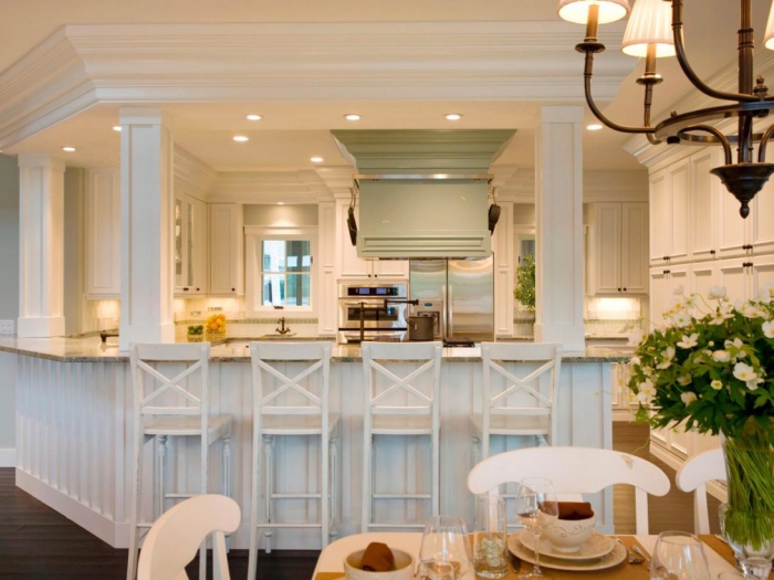 Kitchen cabinet lighting bar lights in an all-white kitchen