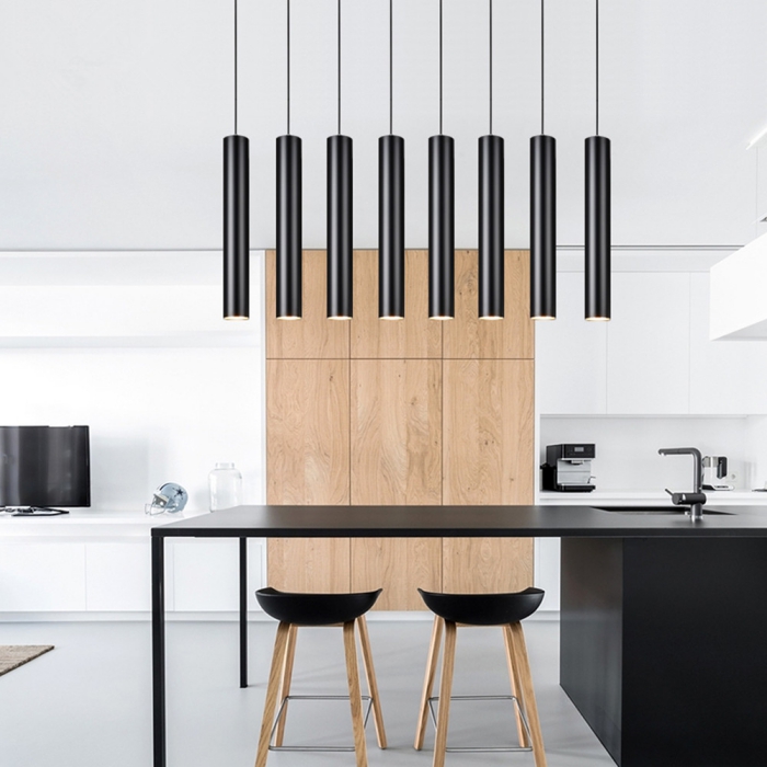 Modern sleek black pendant lights in a minimal contemporary kitchen with black accents