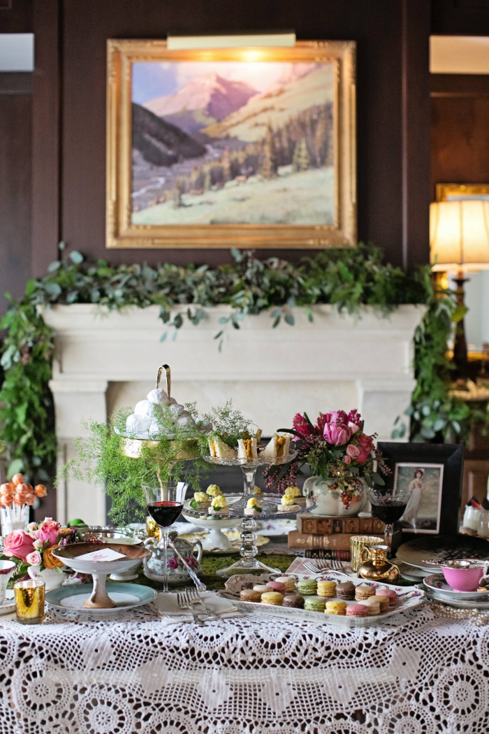 Beautiful luxury hotel interior afternoon tea table with a fireplace in the background