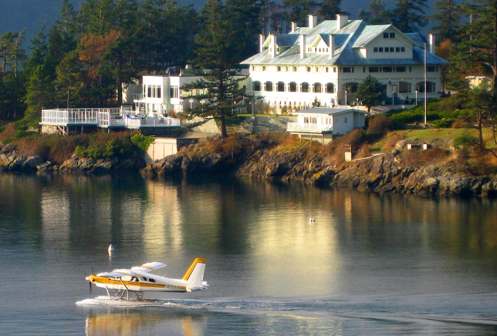 Rosario Resort white building on a lake with water plane