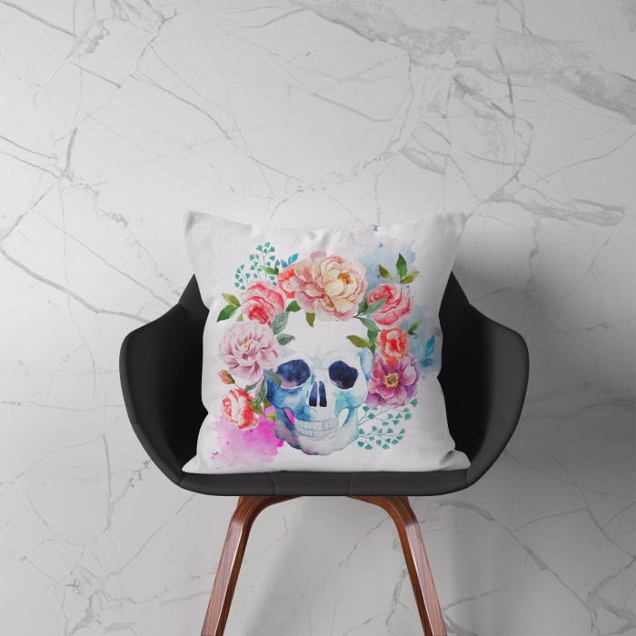 Light cushion on a chair with a skull and flowers