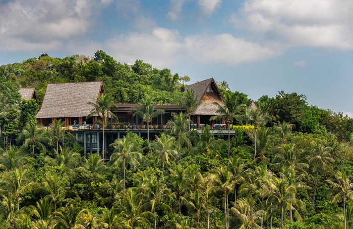 The Spa - Four Seasons Thailand in the middle of a tropical forest with tall palm trees