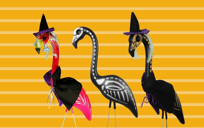 Three Halloween flamingos on a bright background