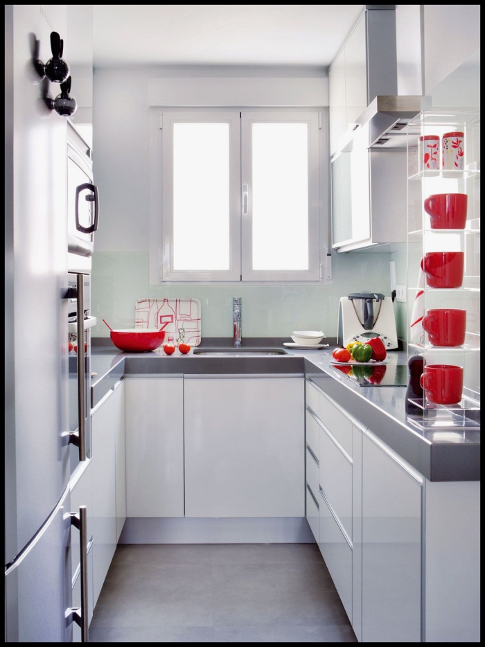 small white kitchen with red accent details