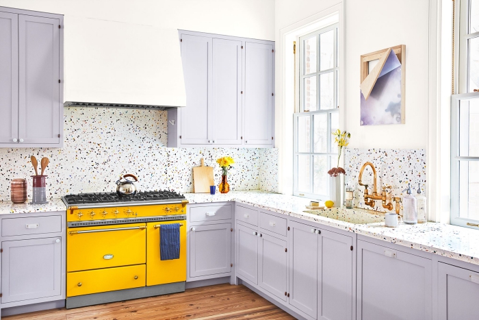 beautiful kitchen in grey with white bright yellow oven