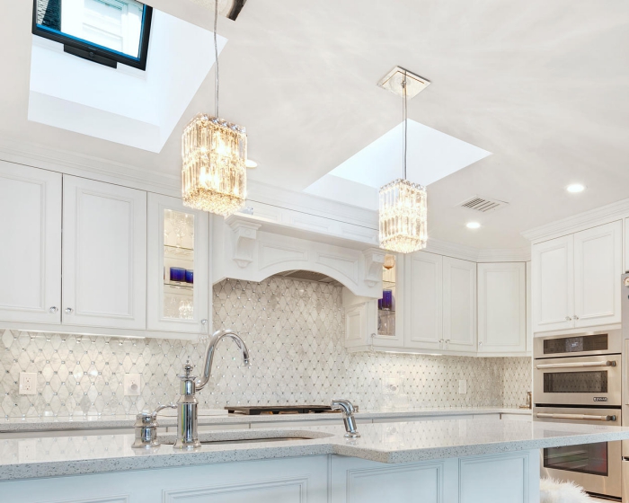 Glamorous White Kitchen with crystal pendant lights