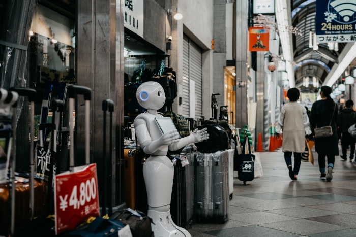 White Robot at the streets of Japan holding menu