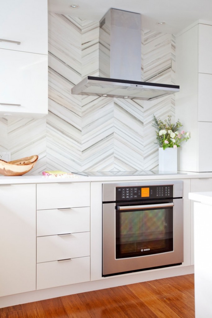 white kitchen with metal elements clean countertop and stove