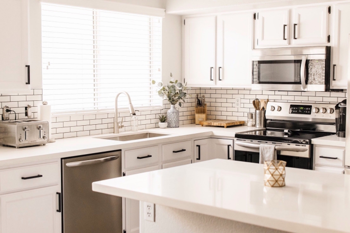 sophisticated modern white kitchen with tiles