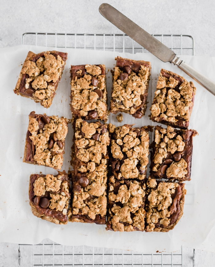 vegan chewy energy bars cut into squares with a knife