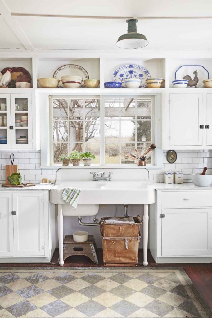 Vintage White Kitchen with small window and colorful ceramic plates