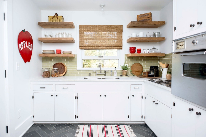 Vintage White Kitchen with natural materials, red accents and dark tile floor