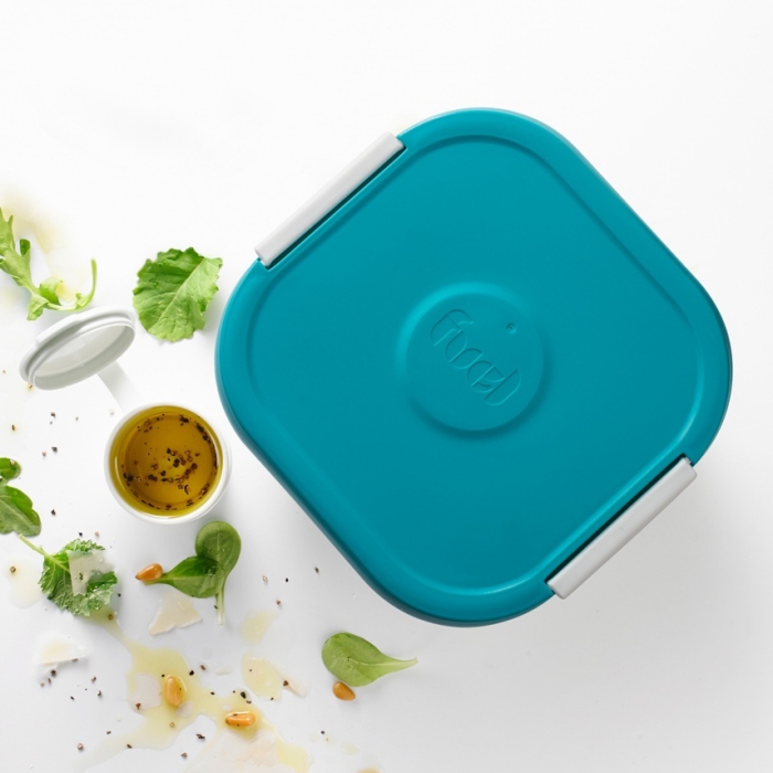 salad container for lunch with a dressing tray with blue lid on a white background