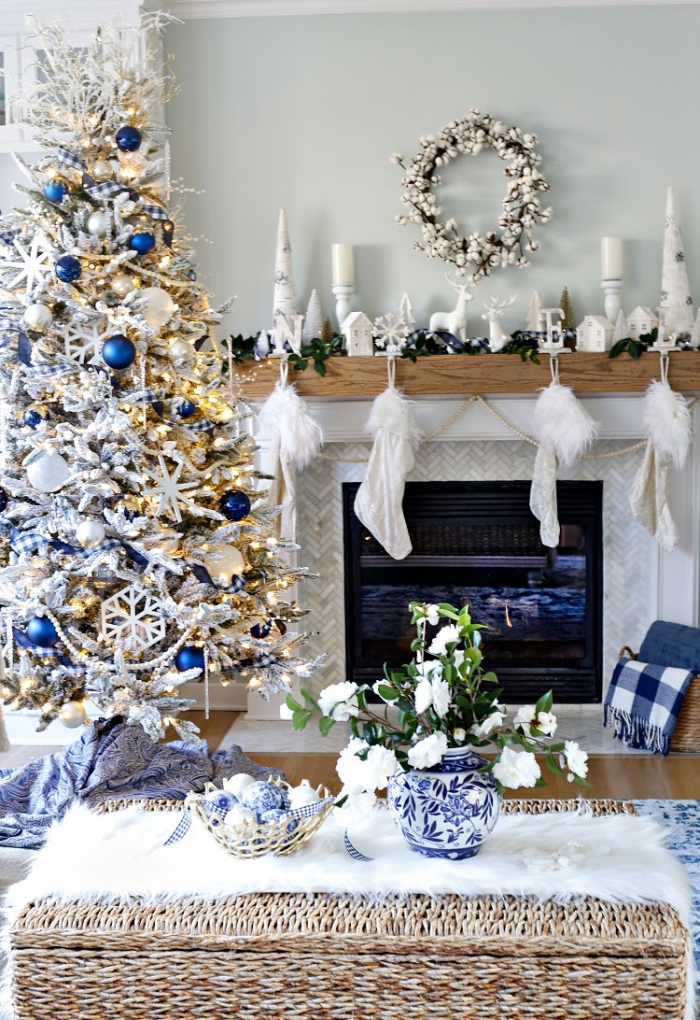 Room decorated in blue and white christmas tree fireplace stockings 