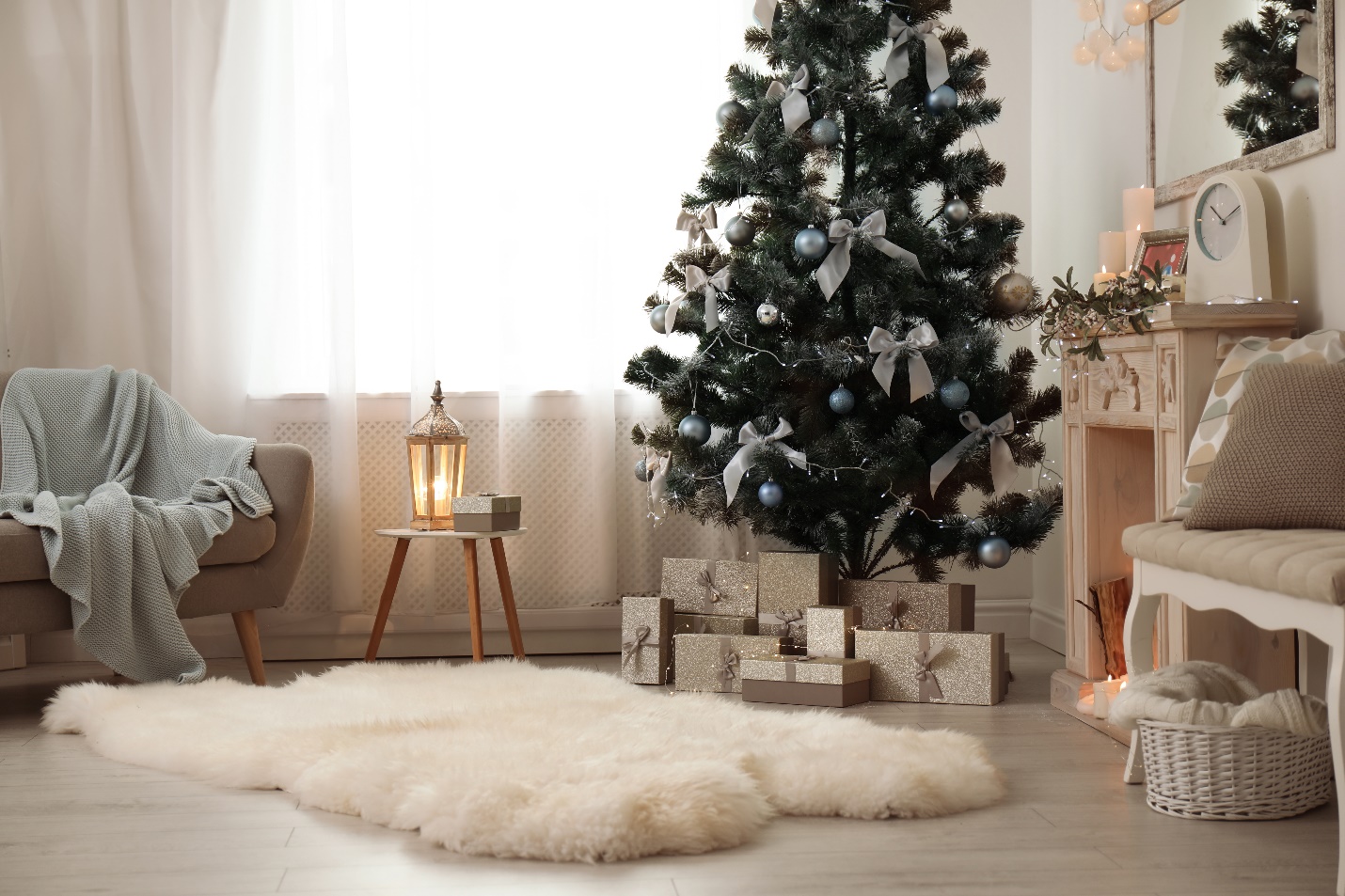 Cozy living room with small Christmas tree and presents under it