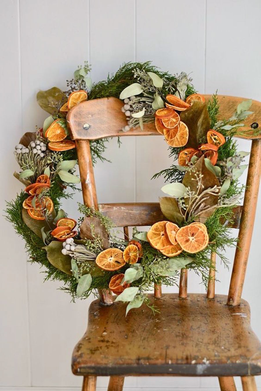 Christmas dried Fruity Wreath on a wooden chair