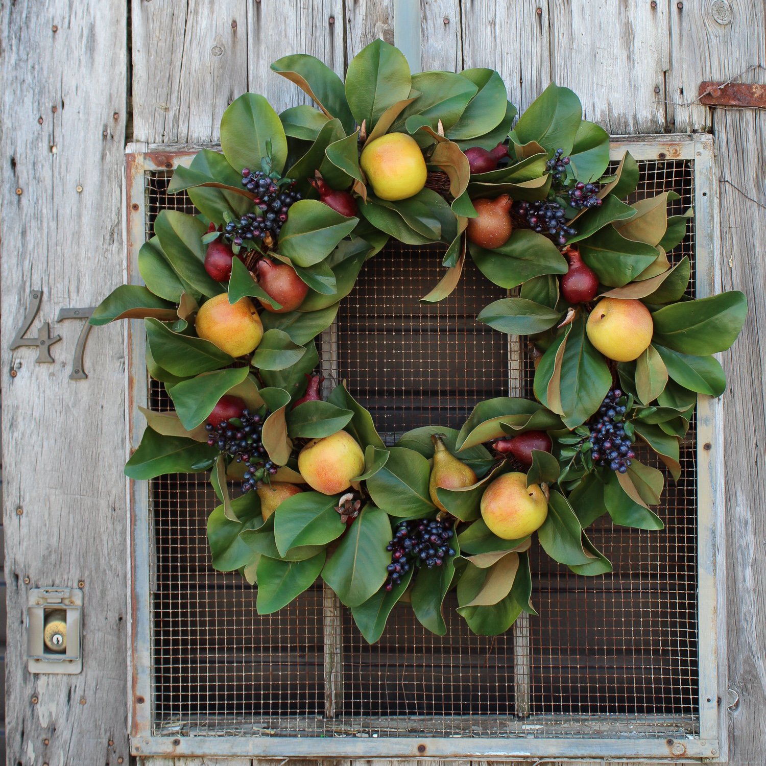 Christmas wreath with apples green leaves berries and fruits