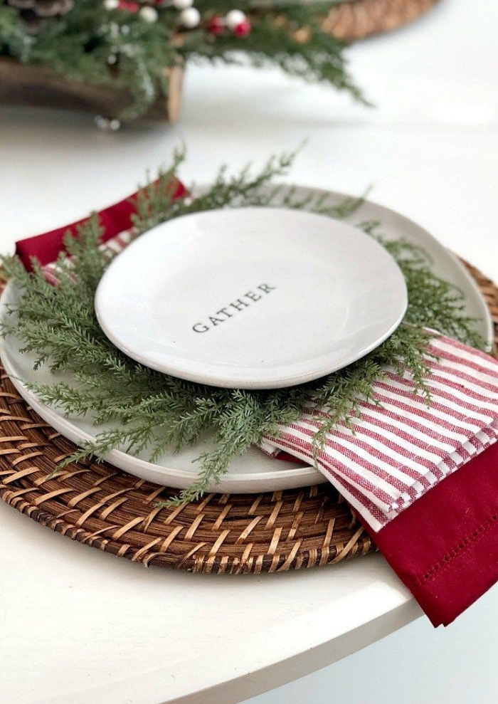 Christmas rustic table setting white plate gather green branches