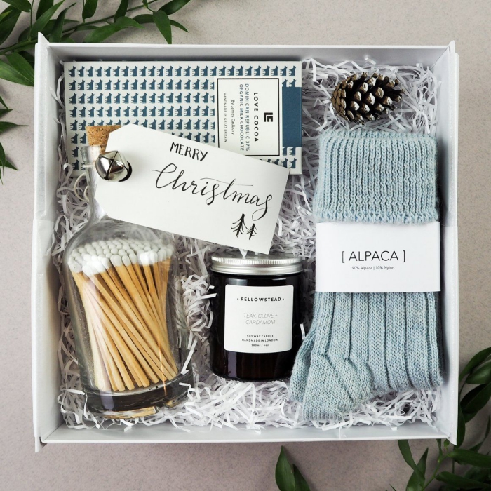 Gift box in blue with socks and other items 