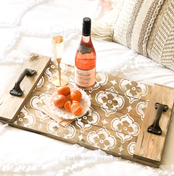 Unique wooden serving tray with white pattern wine bottle elegant tall glass and tangerines