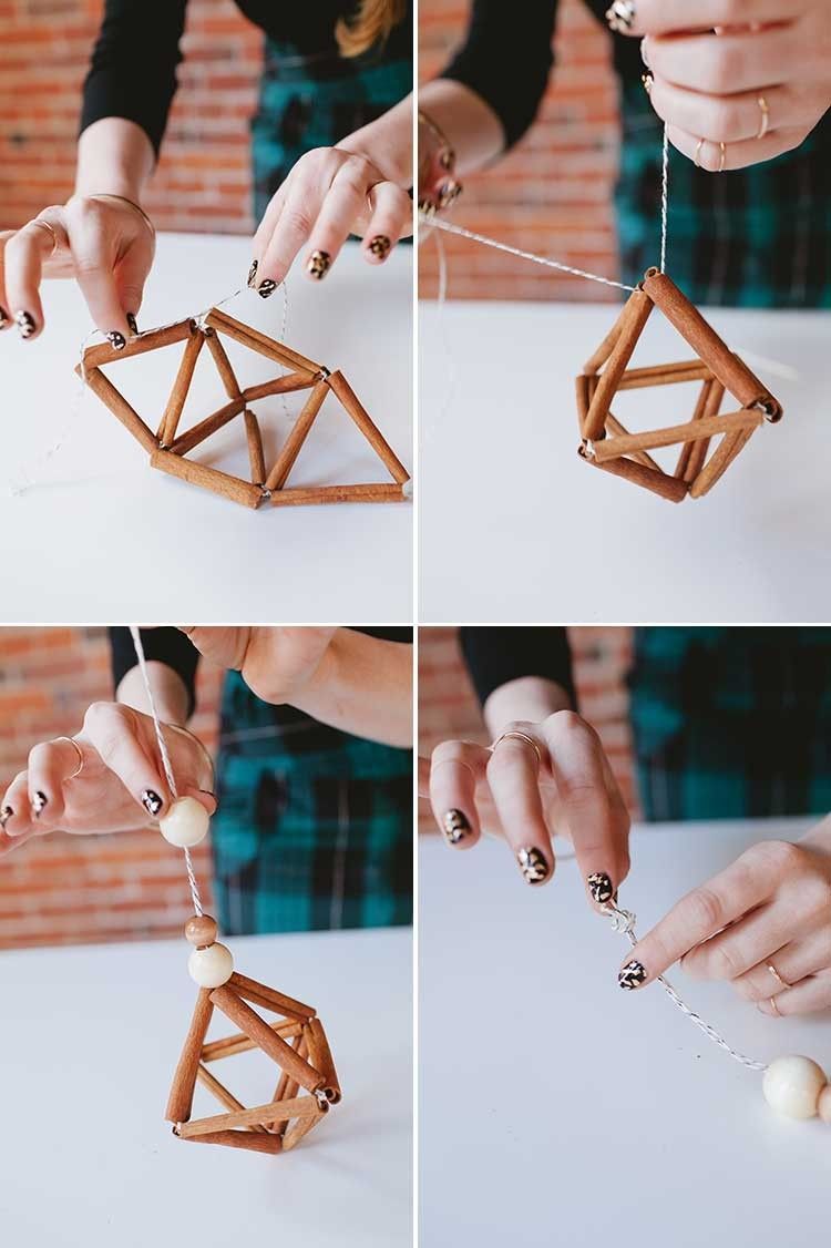 woman crafting Christmas ornaments with cinnamon sticks