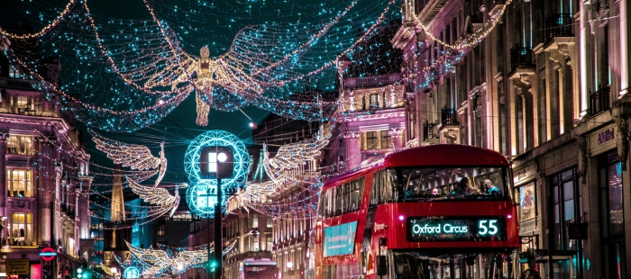 street in london with double decker bright christmas decorations