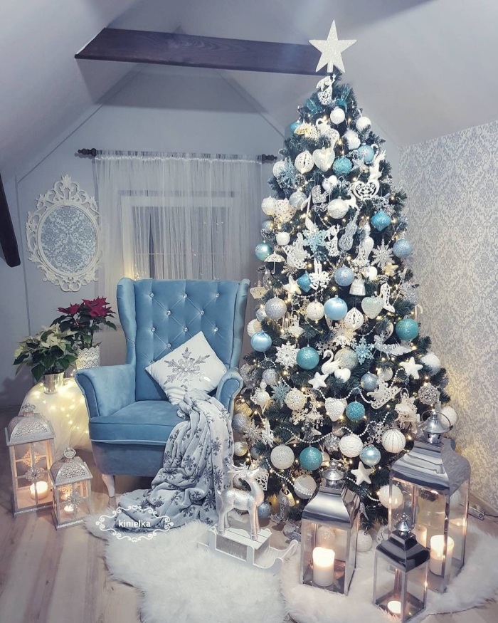 Attic pale blue reading room with white and blue christmas tree reading chair lanterns